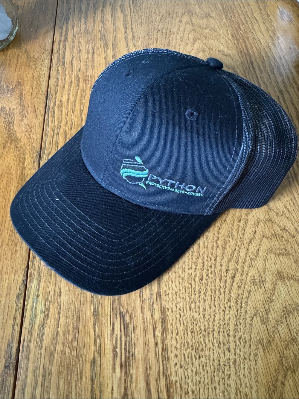 Python Suburban Manufacturing Group Black Mesh Trucker Hat